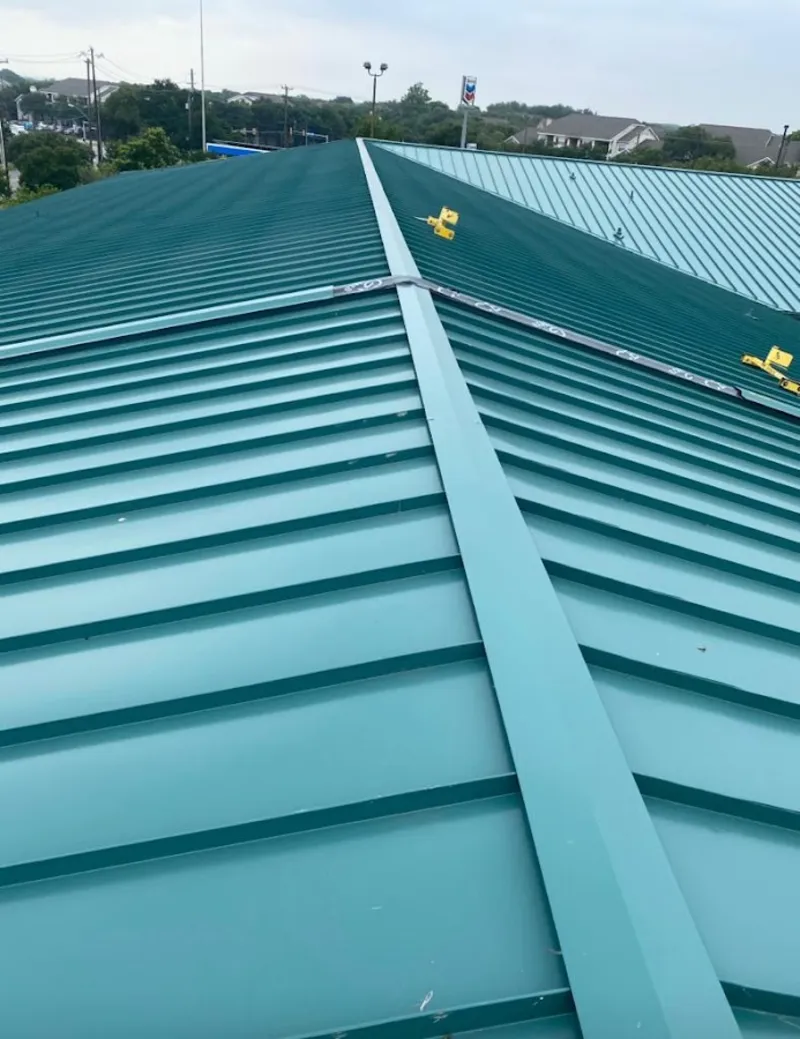 Green commercial metal roof ridge and valley for Metal Roof Repair in West University Place